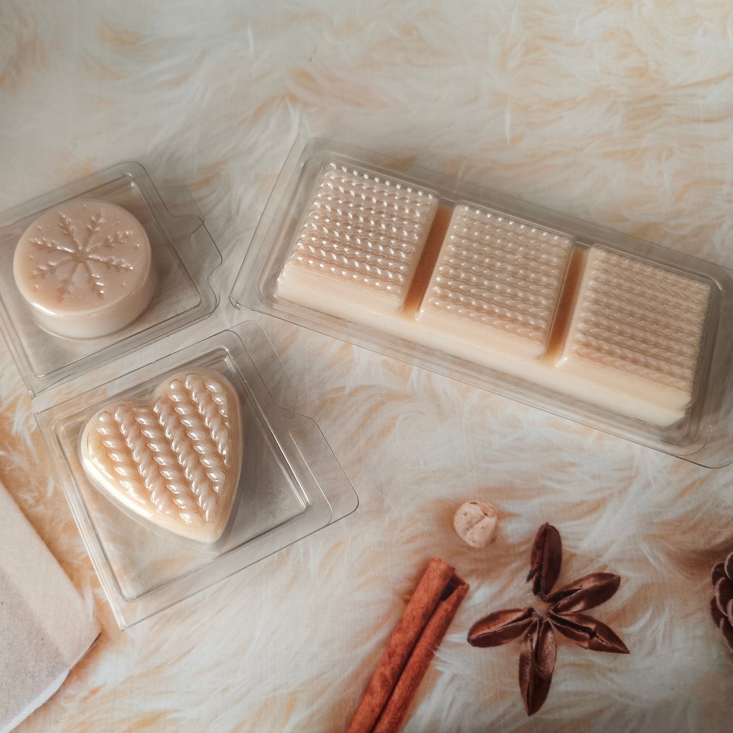 3 different clam shells with a creamy coloured wax melt in each