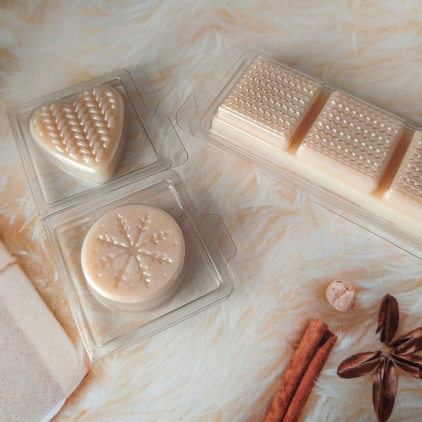 3 versions of available clamshell options in cashmere sweater scented eco soy wax. Light beige in colour